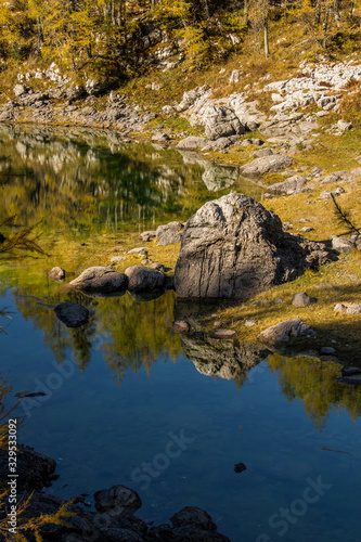The Double Lake with larch trees at Valley of the Triglav Lakes © klemen