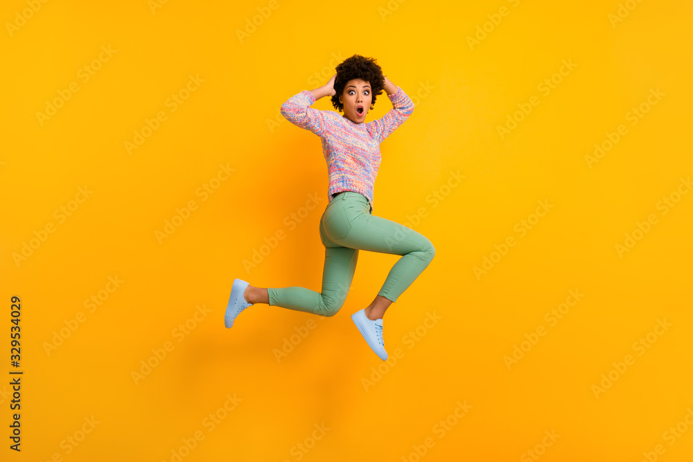Omg black friday. Full body profile side photo impressed crazy dark skin girl forget she want bargain jump run fast touch hands head wear green colorful outfit isolated bright color background