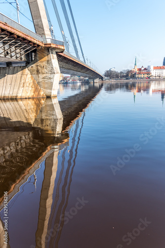 Cityscape of Riga Latvia with Reflections on a Quiet Still River