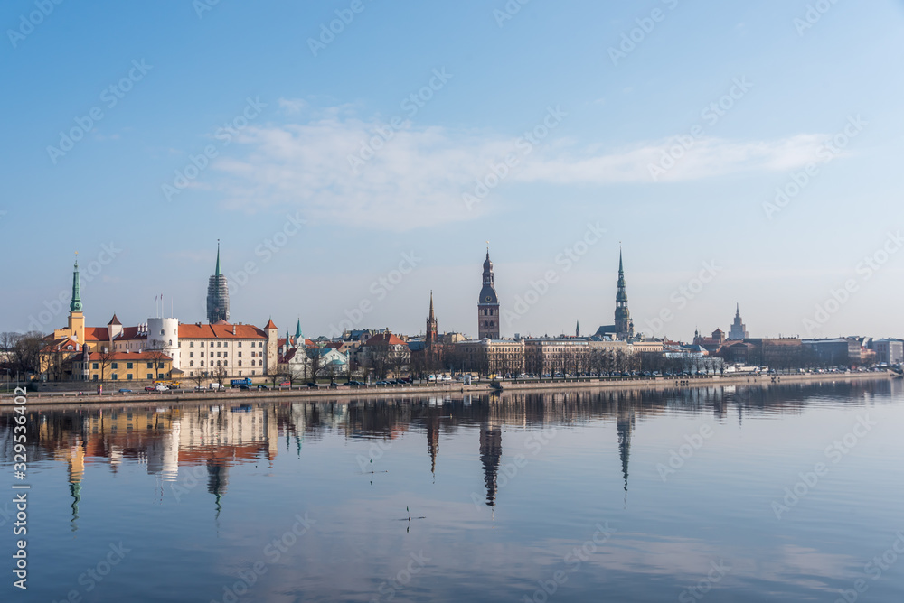 Cityscape of Riga Latvia with Reflections on a Quiet Still River Cityscape of Riga Latvia with Reflections on a Quiet Still River