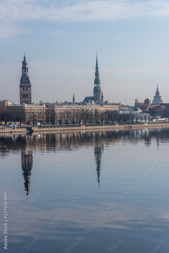 Cityscape of Riga Latvia with Reflections on a Quiet Still River