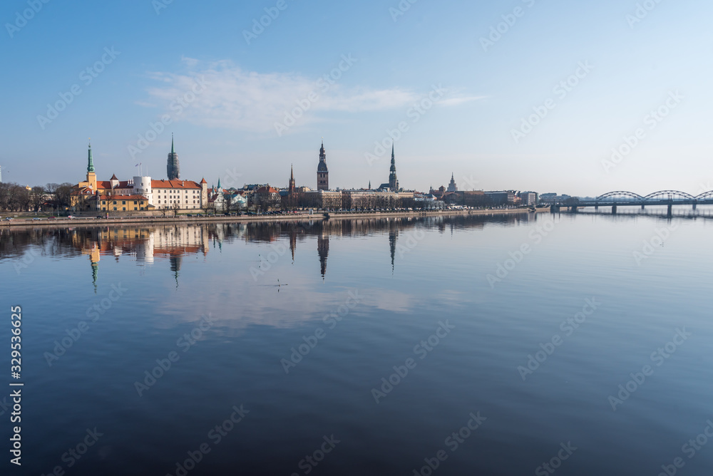 Cityscape of Riga Latvia with Reflections on a Quiet Still River