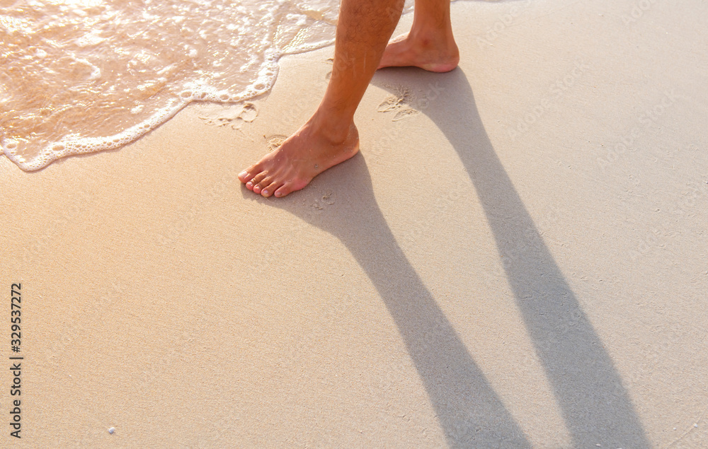 The man was walking happily in the sea at dawn The man was walking happily in the sea at dawn