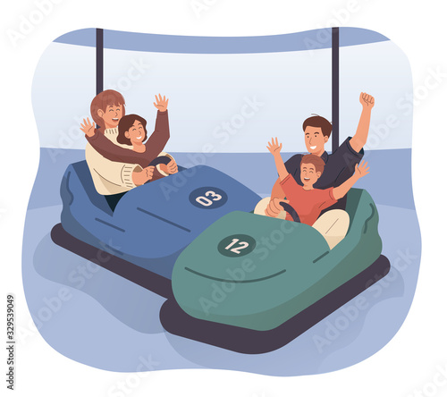 Happy family riding bumper car at amusement park