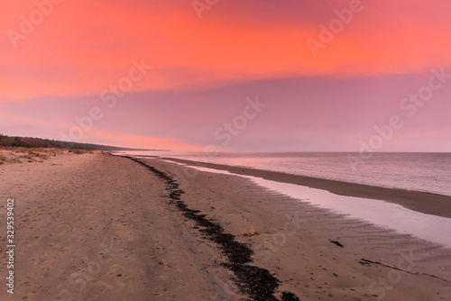 Sand Dunes at Sunset at a Baltic Sea Beach with Waves in the Winter