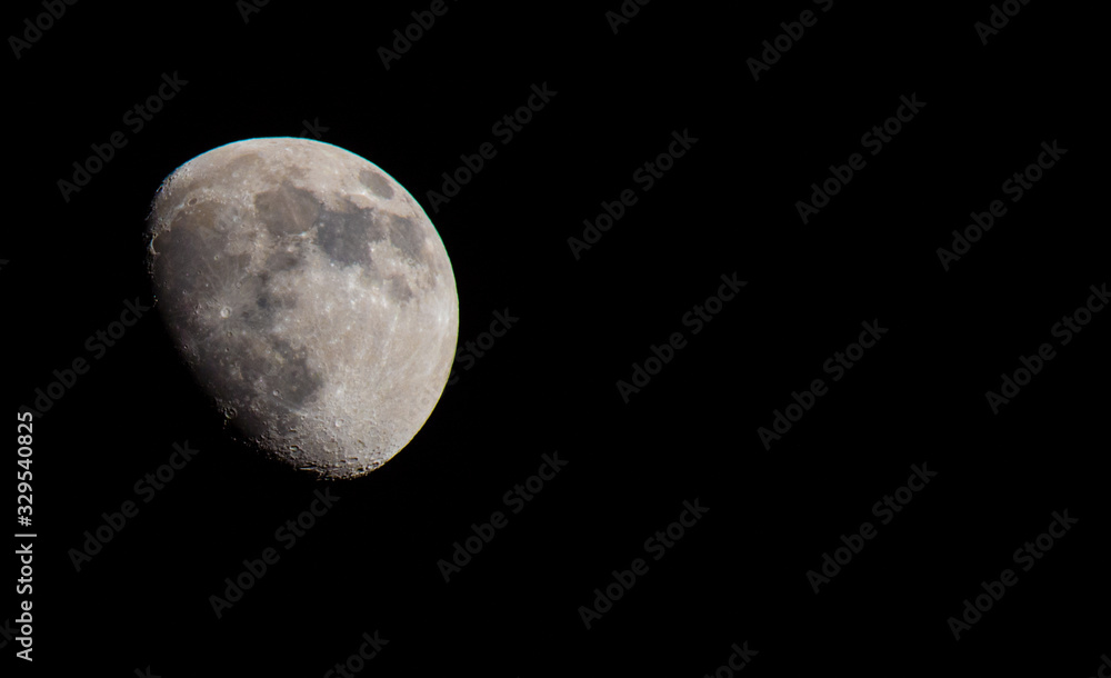 Closeup of a Three Quarter Moon in a Black Sky Closeup of a Three Quarter Moon in a Black Sky