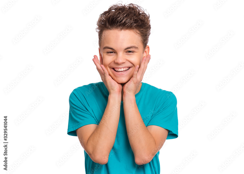 Portrait of happy teen boy, isolated on white background. Photo of adorable young smiling child having fun and looking at camera, front view. Laughing child touches face with his hands. Portrait of happy teen boy, isolated on white background. Photo of adorable young smiling child having fun and looking at camera, front view. Laughing child touches face with his hands.