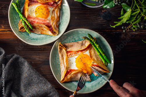 Tableau sur toile Galette,French food buckwheat pancake,with egg in plate