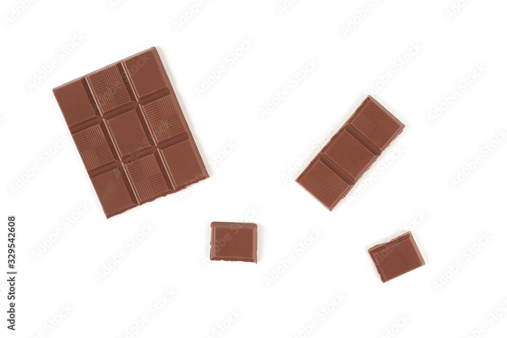 pieces of dark milk chocolate bar isolated on white background. pieces of dark milk chocolate bar isolated on white background.