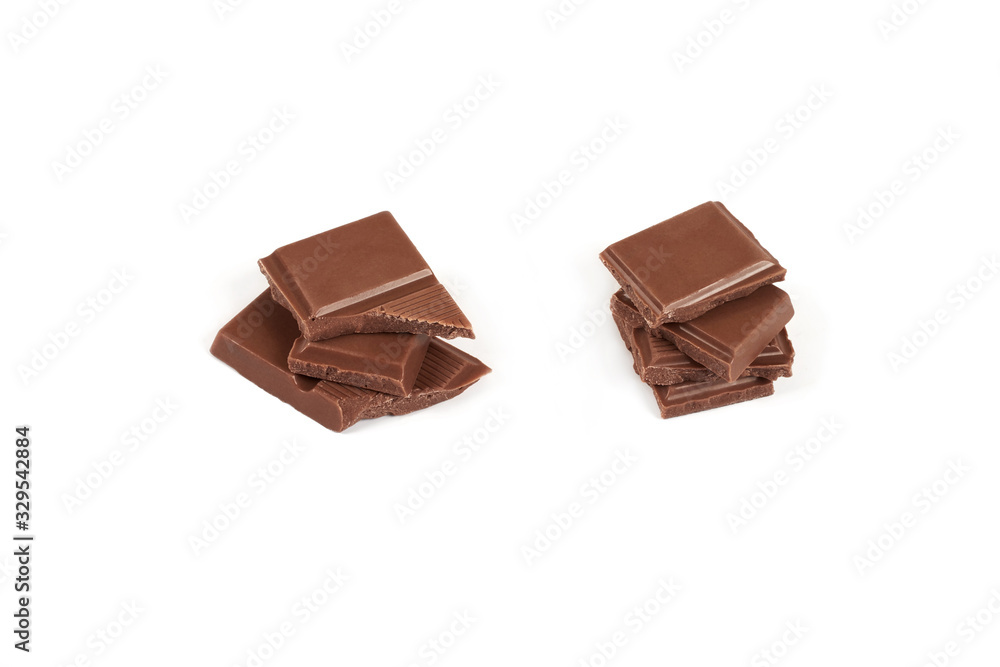 pieces of dark milk chocolate bar isolated on white background. pieces of dark milk chocolate bar isolated on white background.