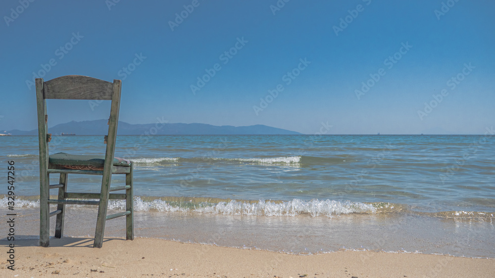 broken chair isolated at the beach
