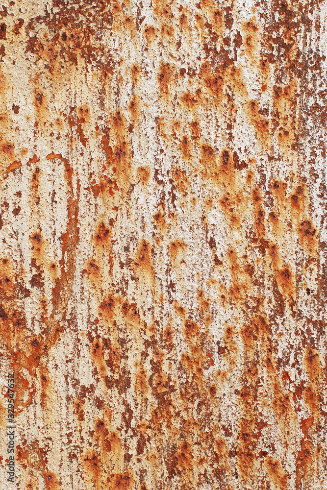 Beige peeling cracked paint on an old abandoned rusty stained sheet of metal. Abstract modern trendy texture background Beige peeling cracked paint on an old abandoned rusty stained sheet of metal. Abstract modern trendy texture background
