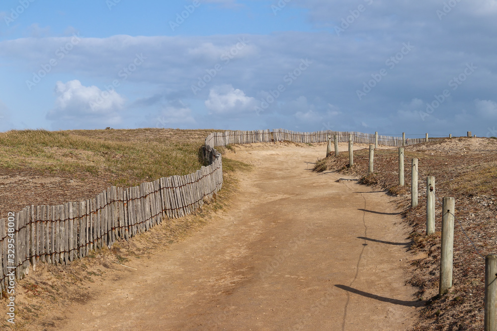 Sandy road along the coast of the peninsula Quiberon Sandy road along the coast of the peninsula Quiberon