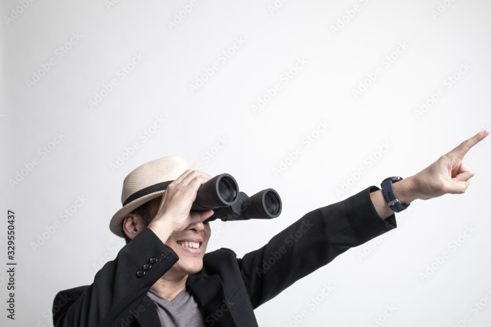 Adult Asian man point and look with binoculars. Adult Asian man point and look with binoculars.