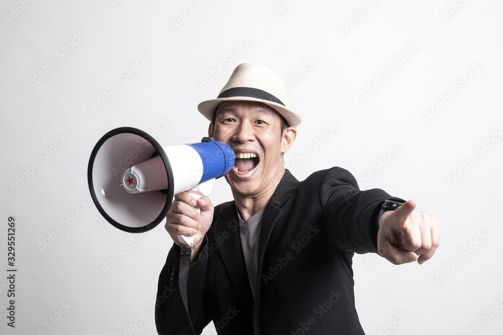 Adult Asian man announce with megaphone. Adult Asian man announce with megaphone.
