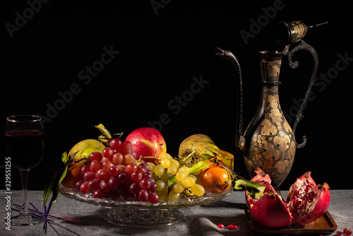 still life with grapes and glass of red wine