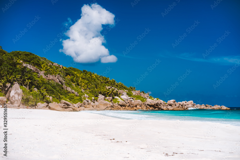 Holiday vacation on Petite Anse sandy tropical paradise beach on La Digue island, Seychelles. Travel exclusive concept Holiday vacation on Petite Anse sandy tropical paradise beach on La Digue island, Seychelles. Travel exclusive concept