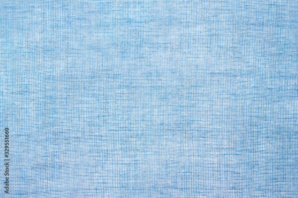 Blue color mesh fabric textured background, canvas, top view, horizontal Blue color mesh fabric textured background, canvas, top view, horizontal