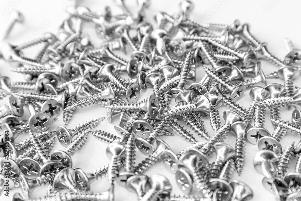 Metal screws on white background. Metal screws on white background.