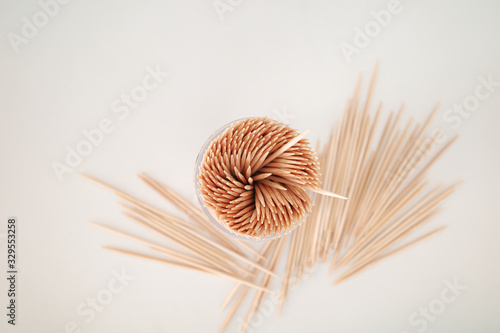 Toothpicks in a box on a white background