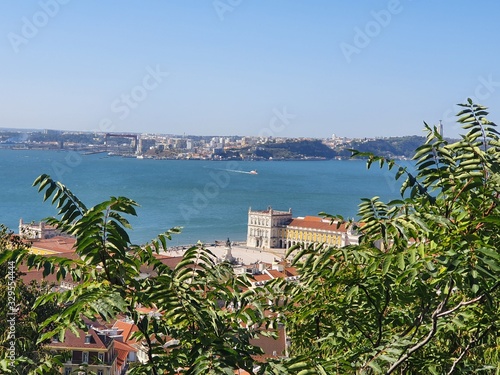 Lisboa - contraste entre a vegetação, a cidade e o rio photo