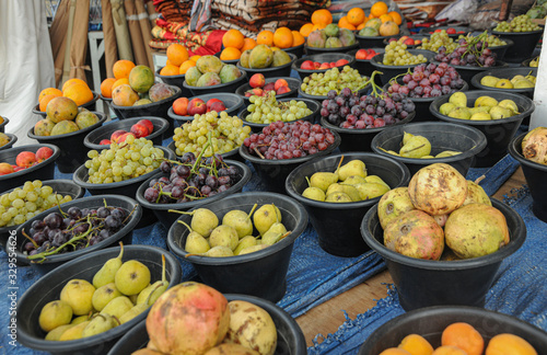 Many fruits in baskets for sale