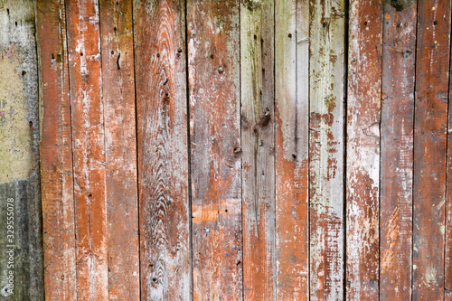 Old wooden painted fence. Painted boards. Background. © Александр Бутылов