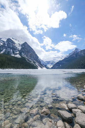 Fototapeta Naklejka Na Ścianę i Meble -  Mount fairview, partly frozen lake, Lake Louise Banff National Park, Alberta Canada