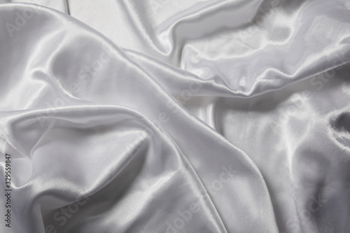 close up view of white soft and crumpled silk textured cloth