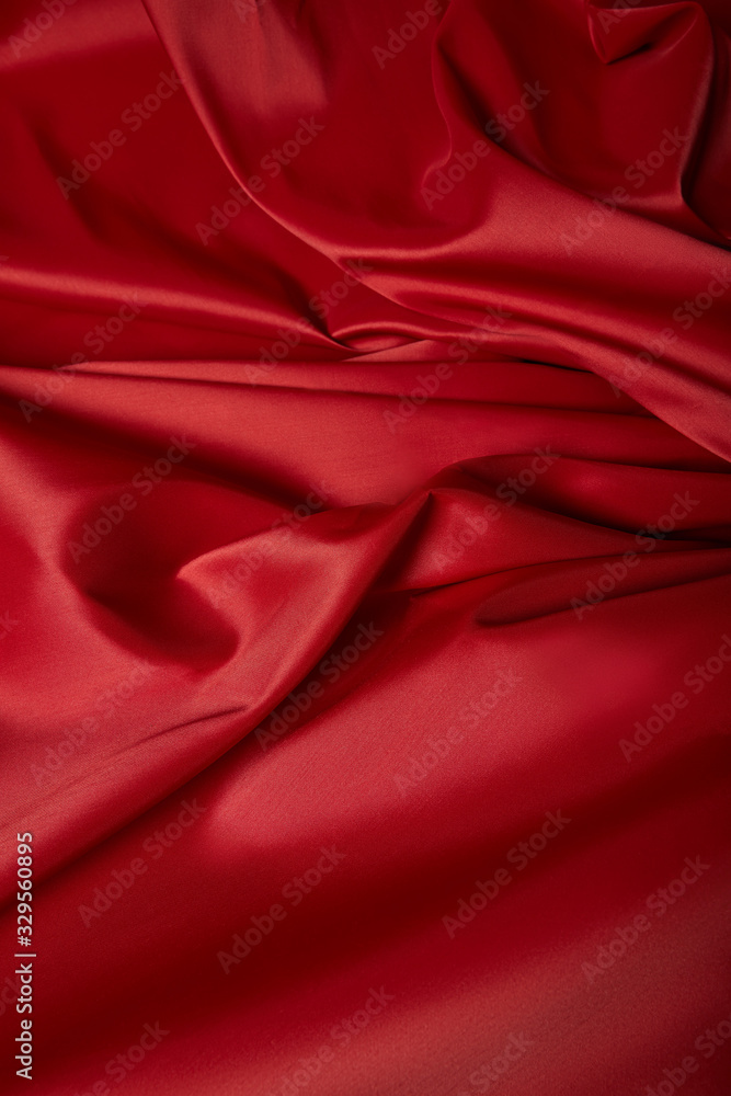 close up view of red soft and crumpled silk textured cloth close up view of red soft and crumpled silk textured cloth