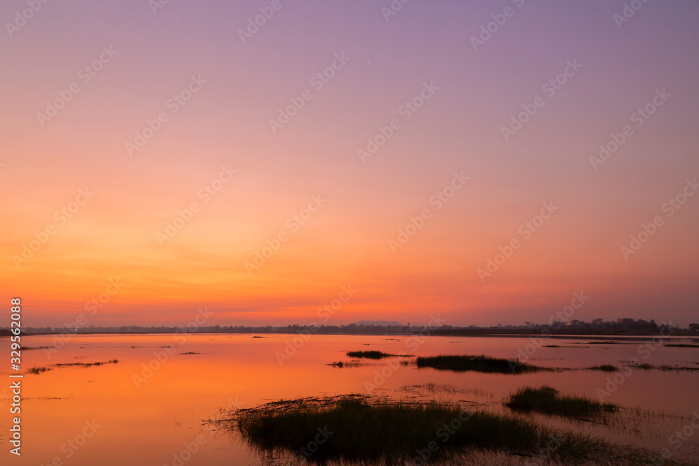 Landscape of the blue sky in the morning over tha river. Bright sky in the morning and orange light. Can use for add text and abstract background..