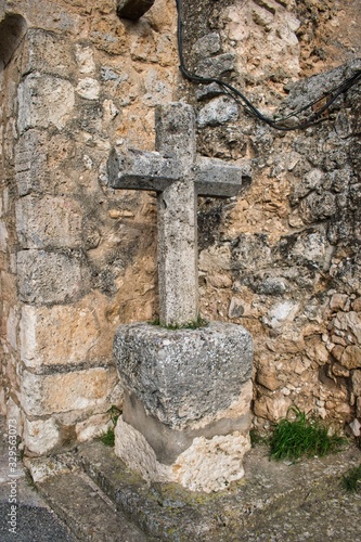 Cruz de piedra en la puerta de la Villa de Maderuelo photo