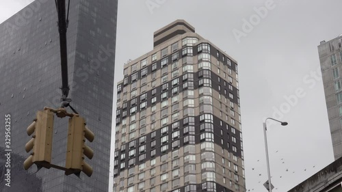 Wallpaper Mural Large pigeon flock flying through Manhattan NYC intersection.mov Torontodigital.ca