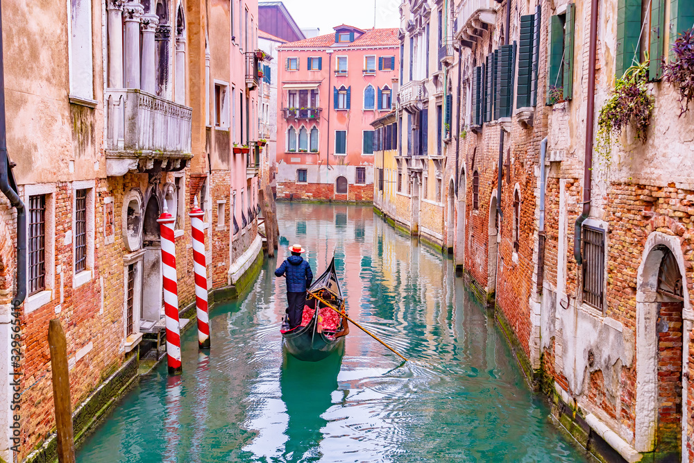 Traditional scenic canal street with venetian gondola in Venice, Veneto, Italy