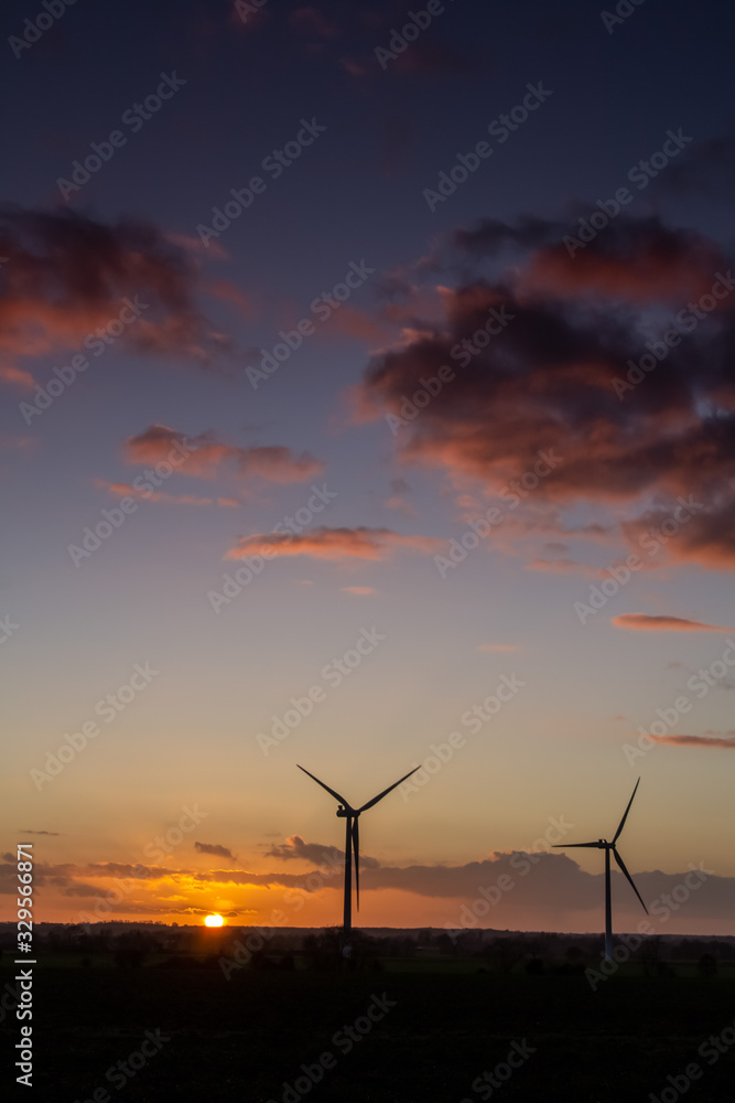 wind turbines at sunset portrait view 