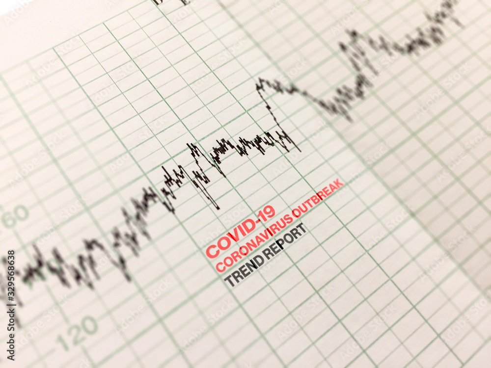 a diagram printed on a printout indicating the trend of the Covid-19 virus outbreak. a diagram printed on a printout indicating the trend of the Covid-19 virus outbreak.