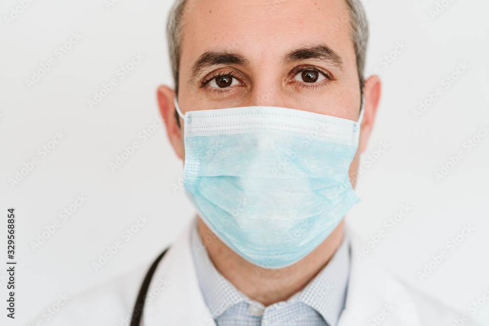 portrait of doctor wearing protective mask and gloves indoors. Corona virus concept portrait of doctor wearing protective mask and gloves indoors. Corona virus concept