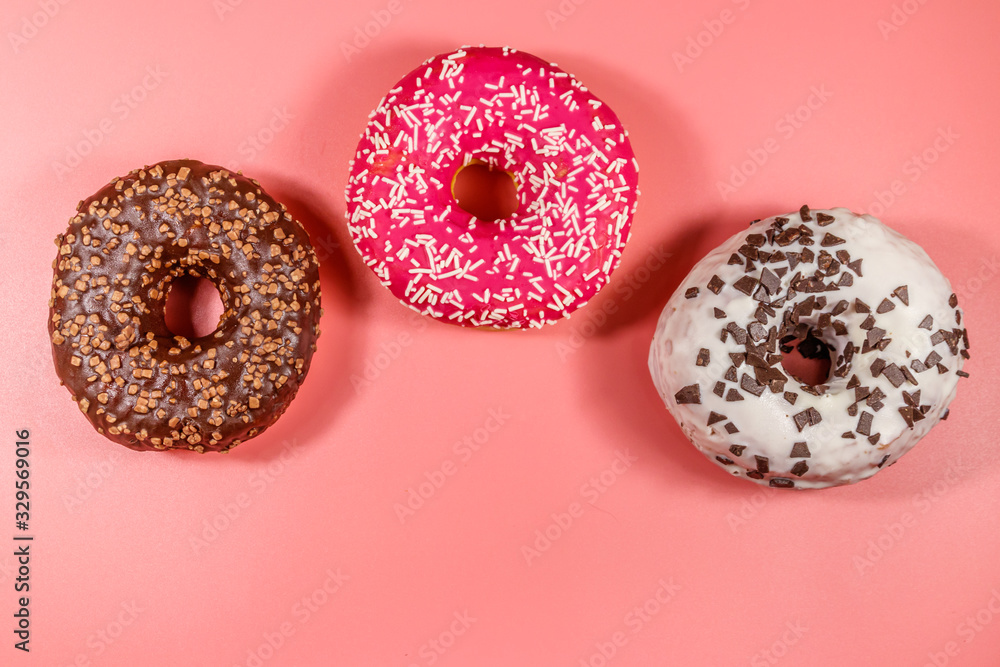 Tasty donuts on pink background. Top view Tasty donuts on pink background. Top view