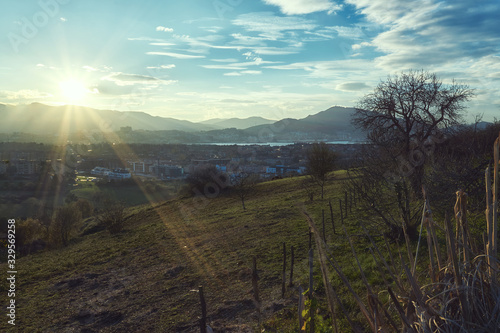Sunset and sun rays landscape Clouds Cloudy day in Leioa View of Serantes mount and El Abra
