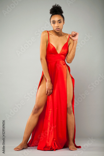 Young african woman in long red dress