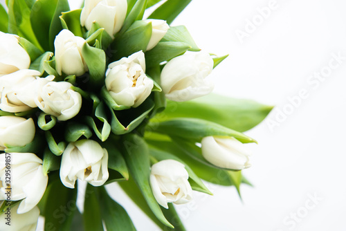 Bouquet of flowers. White Tulip on white background. Beautiful flowers for valentines and wedding scene. Valentines and 8 March Mother Women's Day concept.