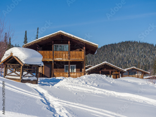 Alpine Village in the ski resort Mountain Salanga. Winter sunny day. Hotel houses