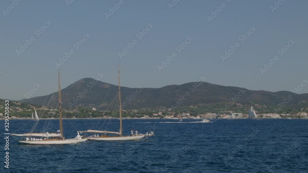 Two classic yachts sailing in a french bay Two classic yachts sailing in a french bay