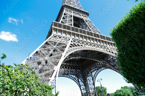Eiffel Tower, symbol of Paris, in a beautiful summer day with blue sky