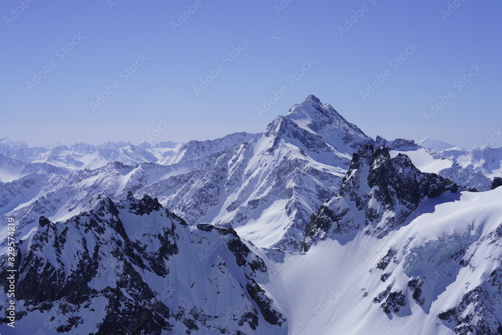 Snow-capped mountains under the blue sky