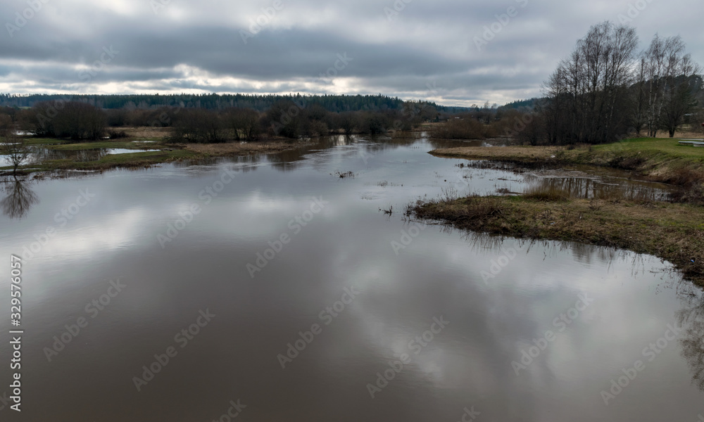 landscape with flooded river in spring