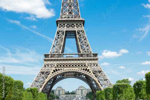 Eiffel Tower, symbol of Paris, in a beautiful summer day with blue sky