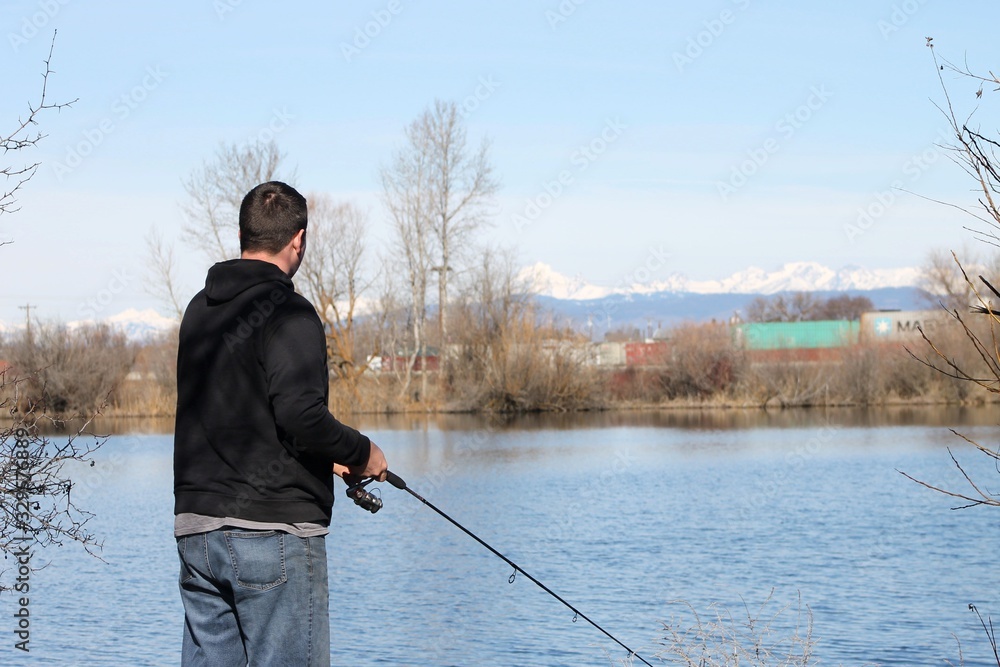 Fisherman on a spring morning at the lake 