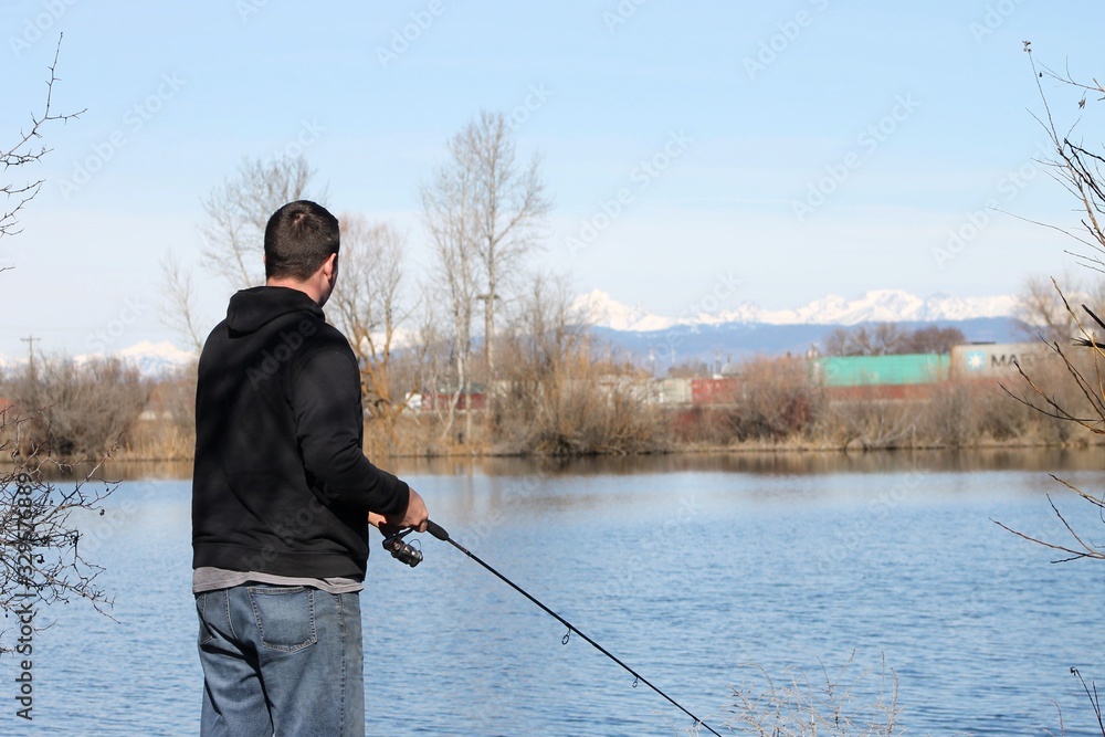 Fisherman on a spring morning at the lake Fisherman on a spring morning at the lake