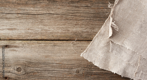 Konstfotografi gray kitchen textile towel folded on a gray wooden table from old boards, top vi